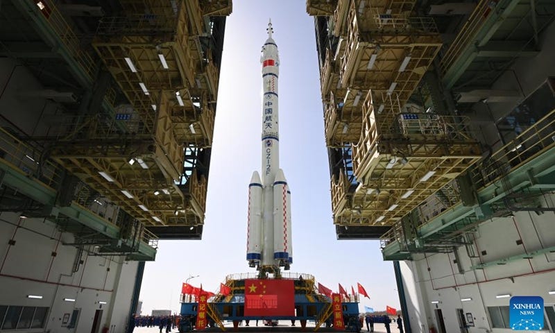 This photo taken on April 17, 2024 shows the combination of the Shenzhou-18 crewed spaceship and a Long March-2F carrier rocket being transferred to the launching area of the Jiuquan Satellite Launch Center in northwest China.(Photo:Xinhua)