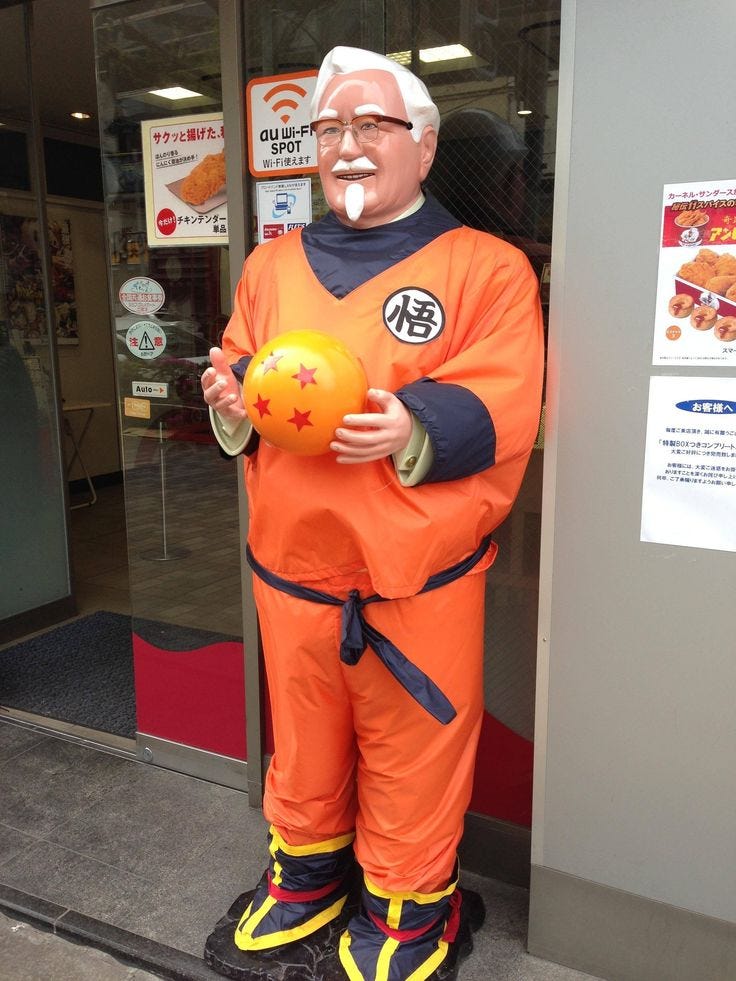a man in an orange outfit holding a ball