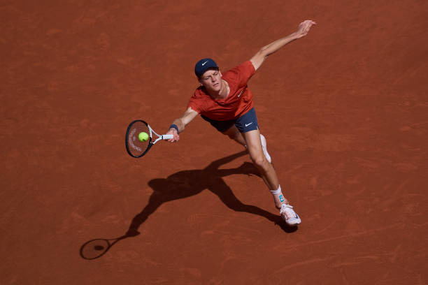 Jannik Sinner of Italy plays a forehand against Grigor Dimitrov of Bulgaria in the Men's Singles Quarter Final match during Day Ten of the 2024...