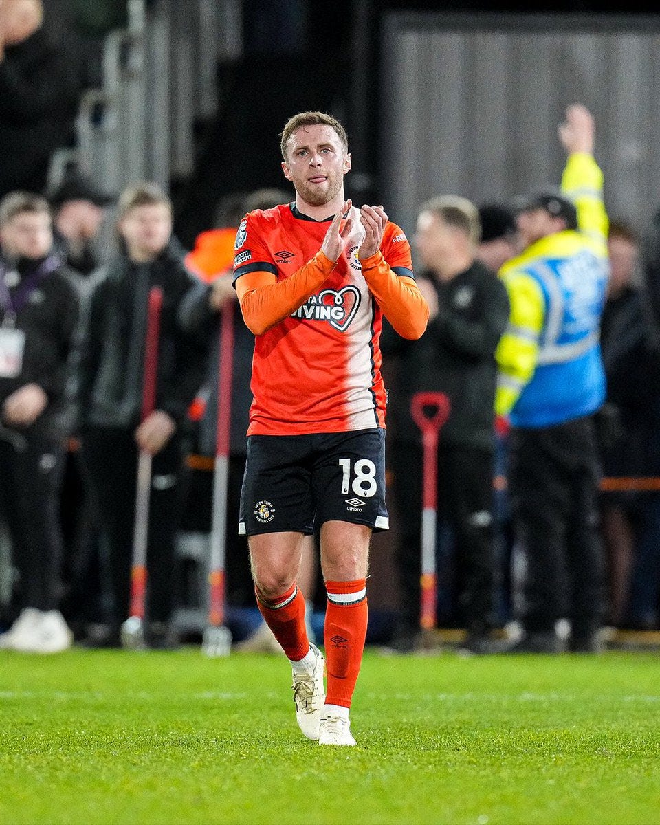 Jordan Clark clapping the Luton fans at full-time.