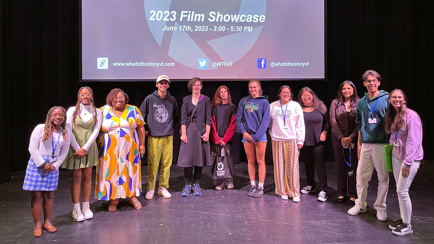 Young filmmakers posing on stage at the end of the film showcase