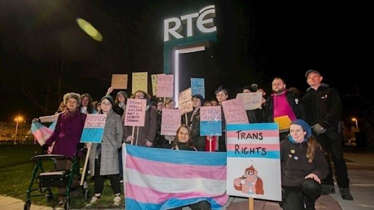 A group of people holding signs AI-generated content may be incorrect. A group of people holding signs AI-generated content may be incorrect.