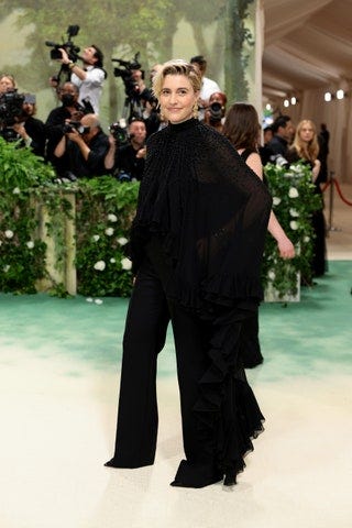 Image may contain Greta Gerwig Adult Person Camera Electronics and Fashion