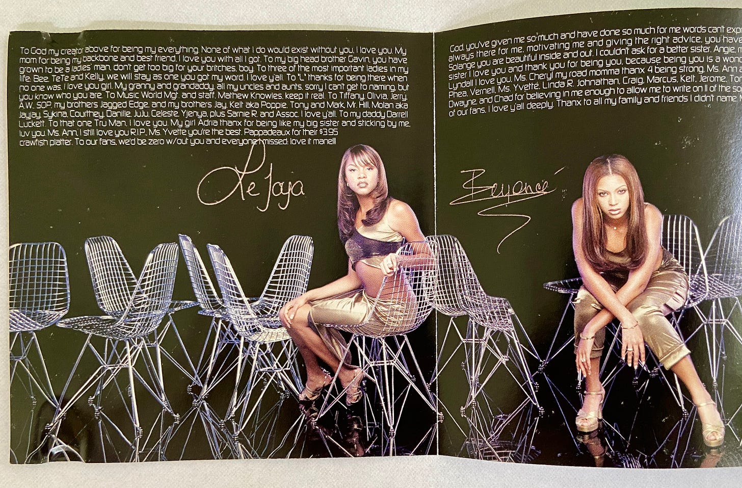 individual album thank yous inside the CD booklet. LeToya and Beyonce pose on metal chairs with text above their heads. their signatures are written next to their heads.