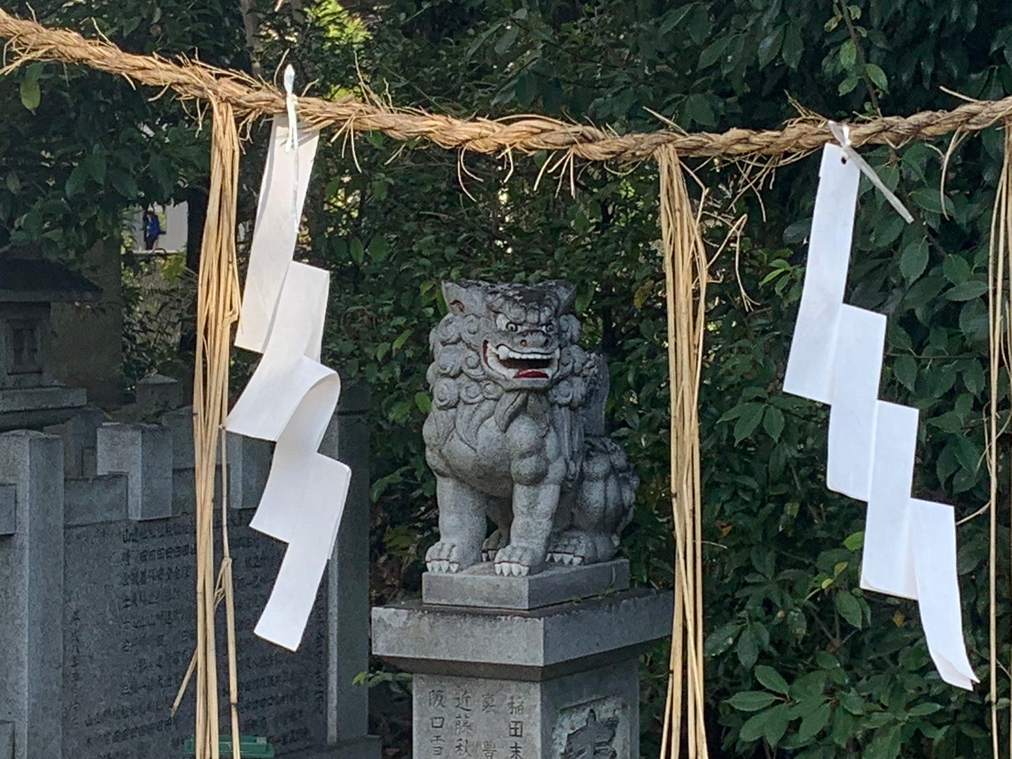 A lion statue sits growling inside a shrine. 