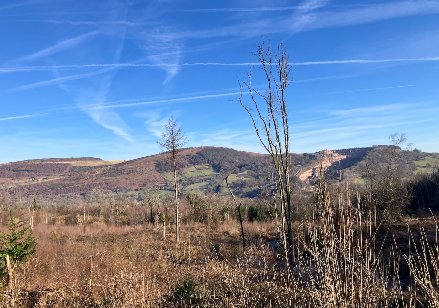 A view of hills under a blue sky