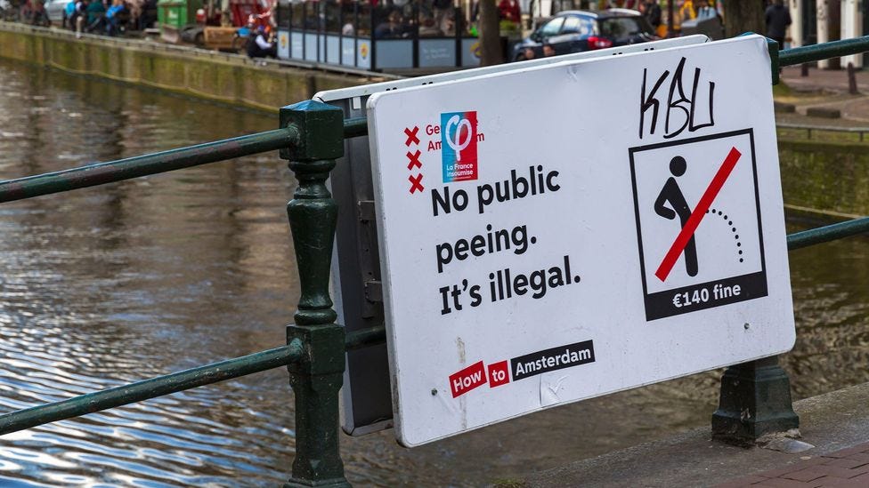 Signs across Amsterdam now remind visitors that it is not okay to urinate in public (Credit: Carolyn Jenkins/Alamy)