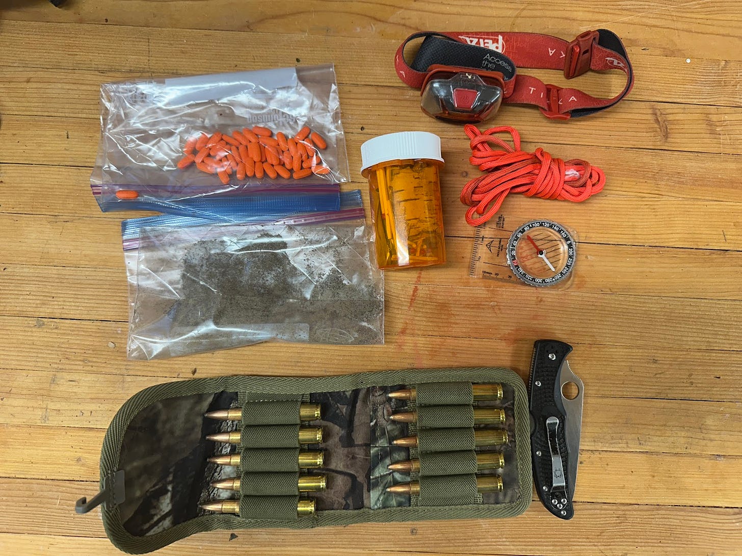 Jesse McEntee's survival kit with a few more important items for emergencies.