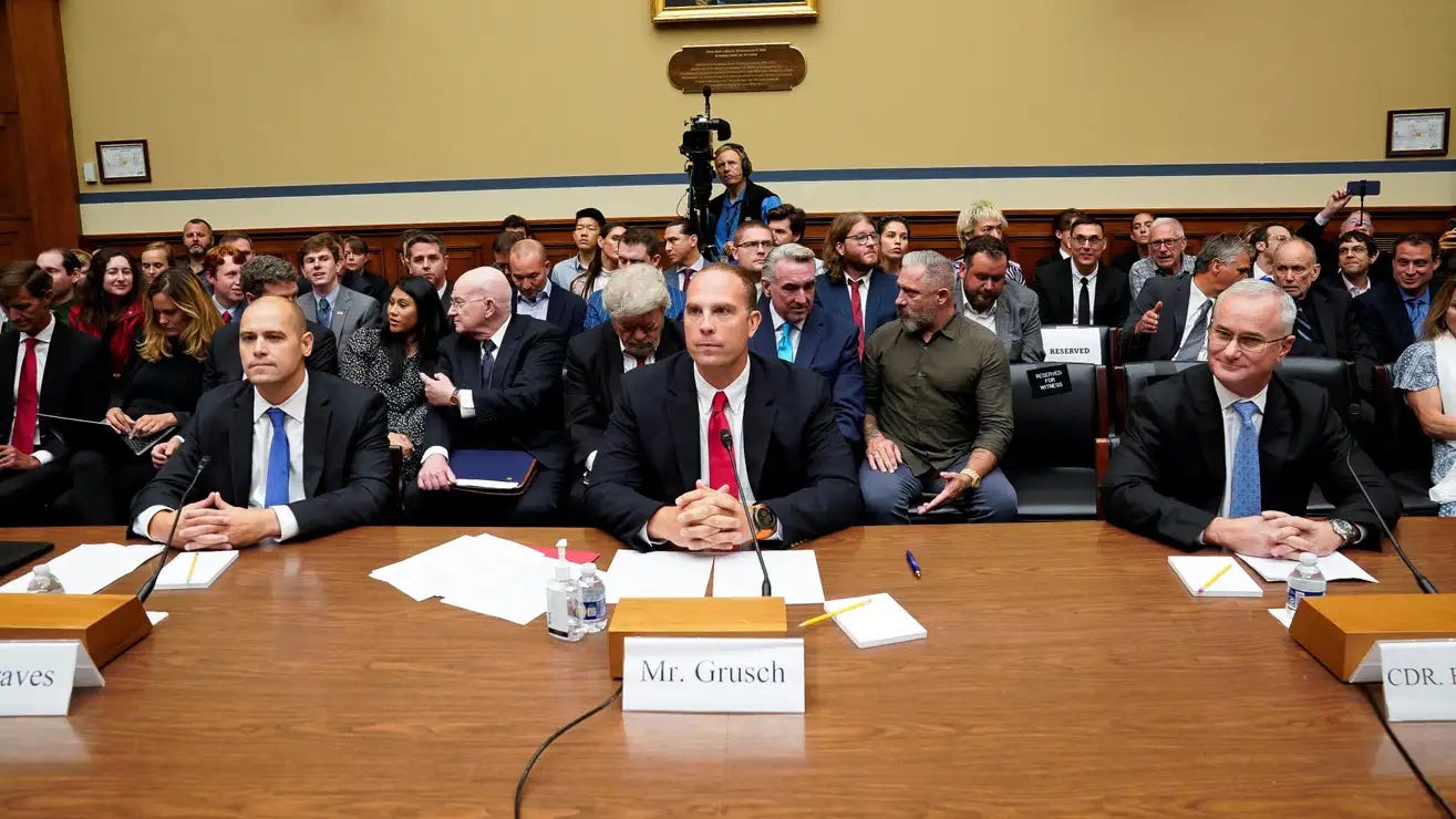 Ryan Graves, executive director of Americans for Safe Aerospace (left), retired Air Force Maj. David Grusch and retired Navy Cmdr. David Fravor are sworn in during a House Oversight and Accountability subcommittee hearing on UFOs on Wednesday.