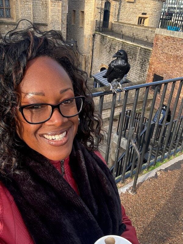 The author, Bernette, at the Tower of London with a guest appearance by one of their resident guardians.