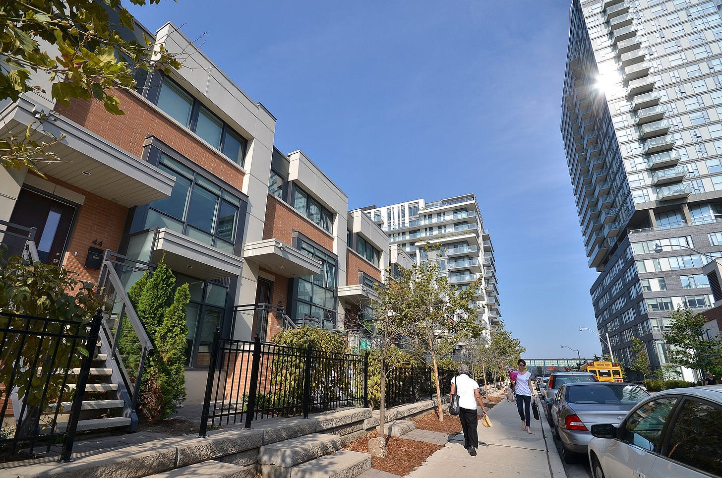 A Toronto residential street, with townhouses and a condo building