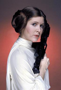 Princess Leia holding a bad-ass-looking weapon.