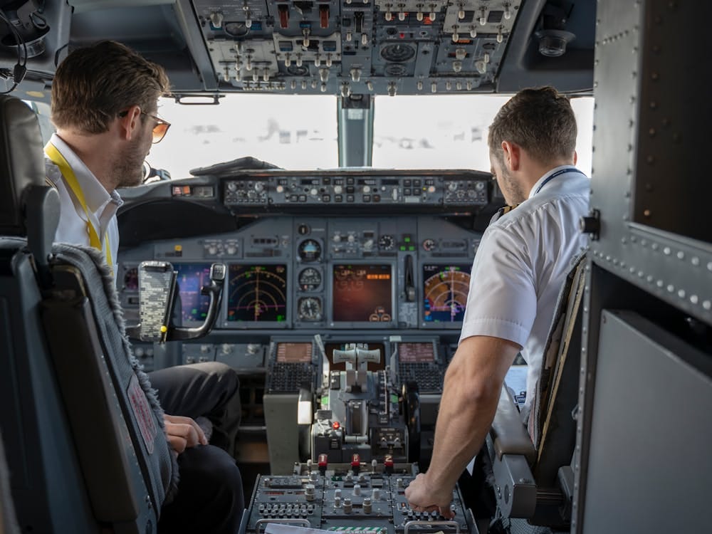 Free Two Pilots Sitting Inside Plane Stock Photo