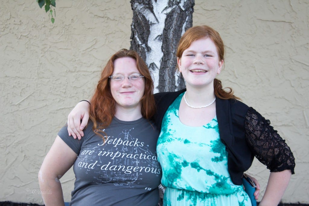 My Redhead and I - She is getting tall. 