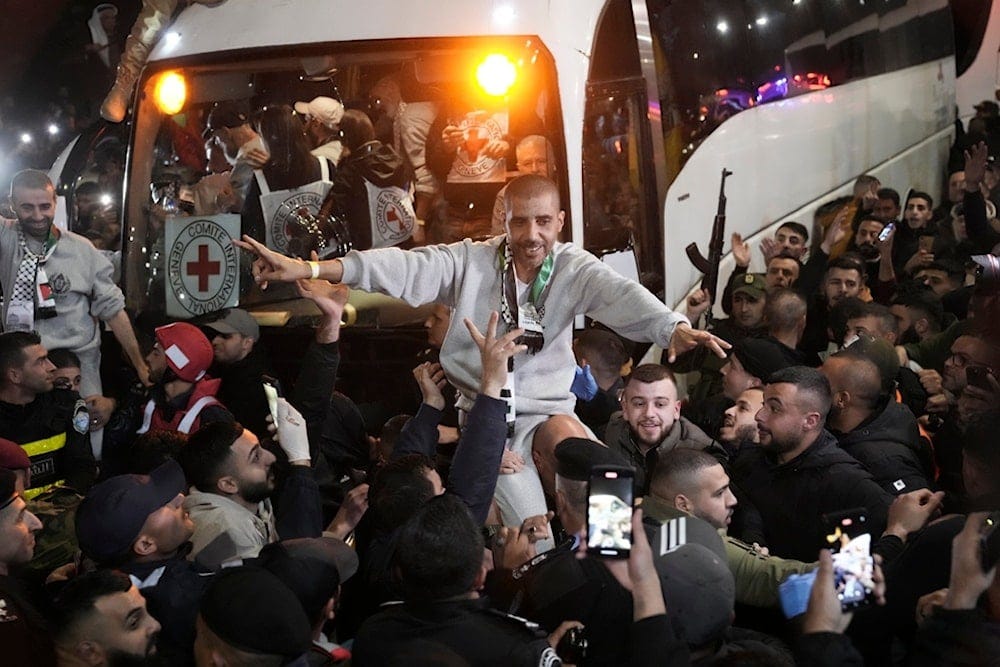 Crowd greets Zakaria Zubeidi, a prominent former resistance leader, after he was released from Israeli prison following a ceasefire agreement between the Israeli occupation and Hamas, in the West Bank city of Ramallah, Thursday, Jan. 30, 2025