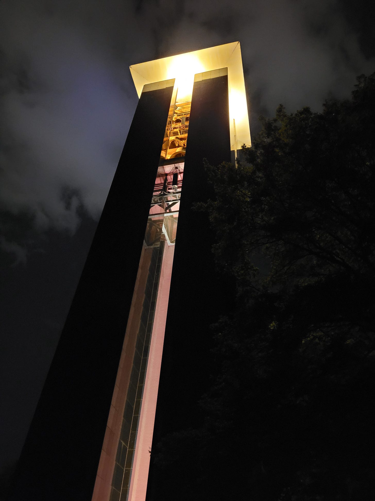 A tall, modern looking bell tower