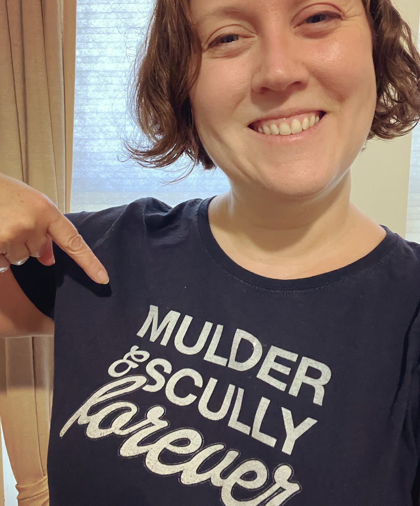 Me wearing a shirt that says "Mulder & Scully forever"