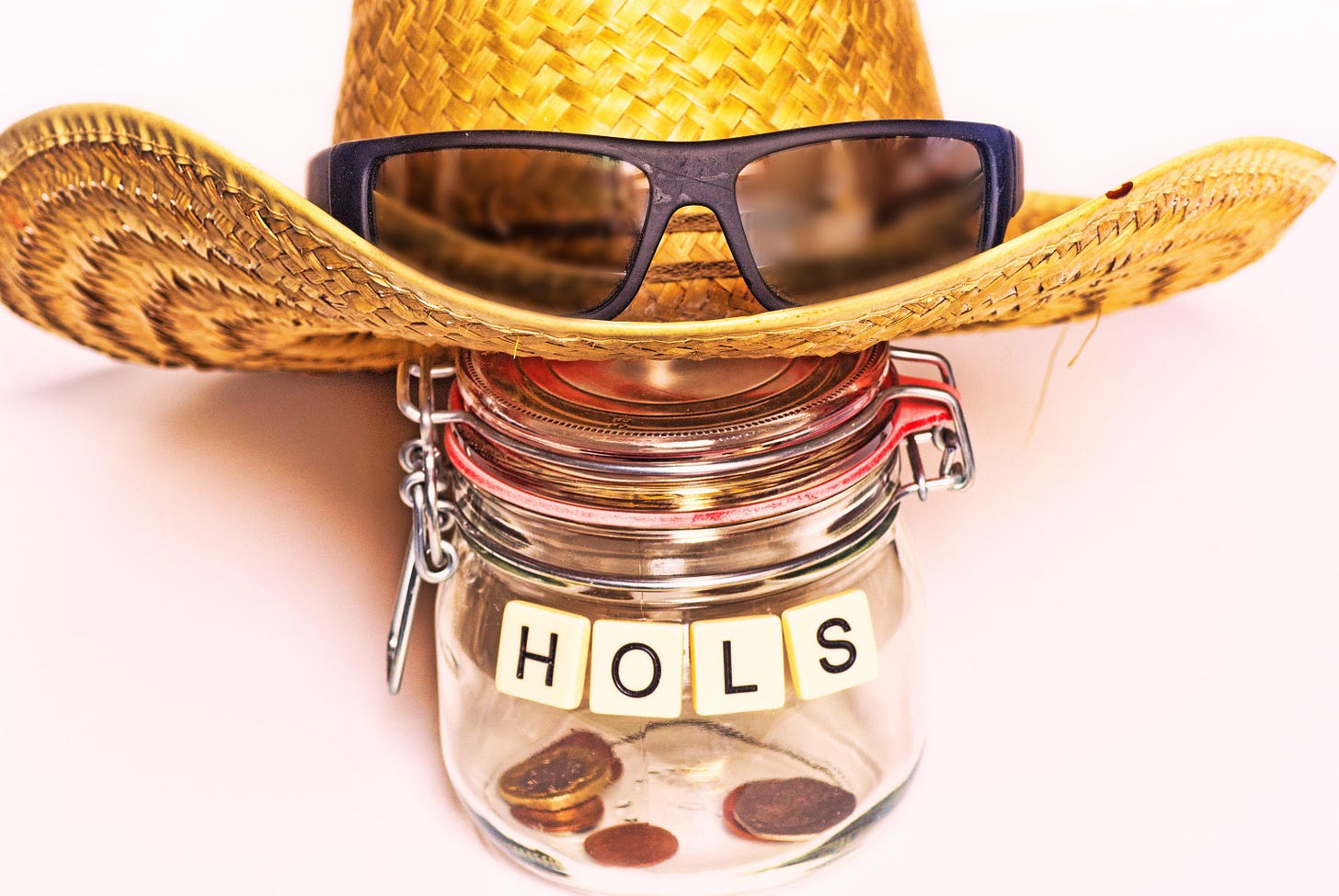 Sun hat with sunglasses and glass jar for holiday savings