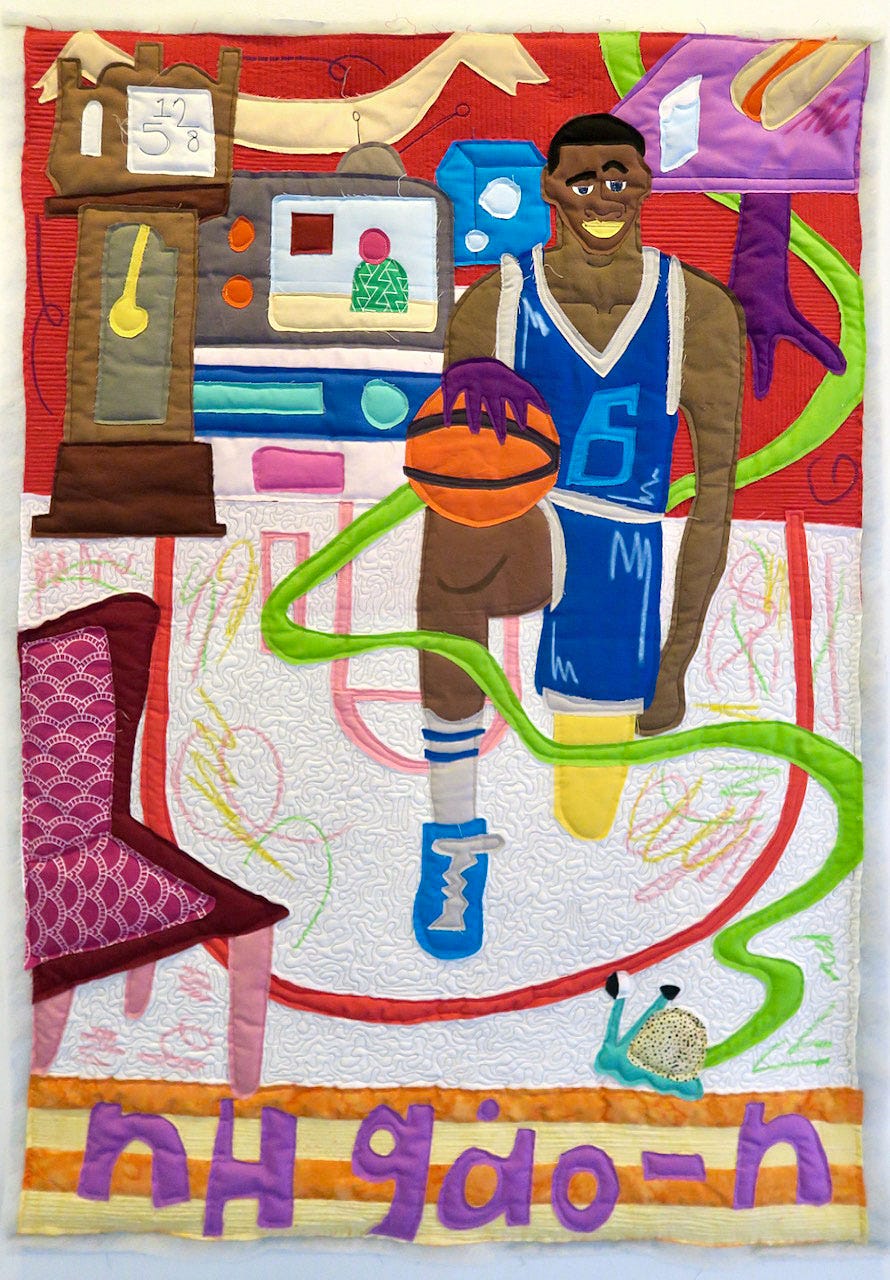 A quilt with a basketball player

Description automatically generated