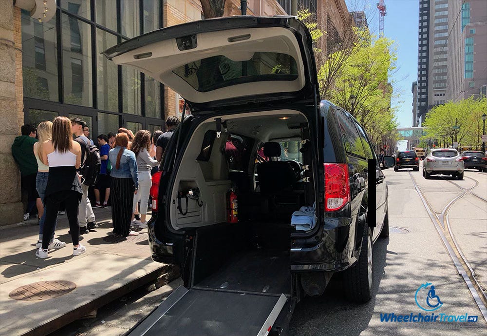 Lyft Access wheelchair van with rear entry ramp extended.