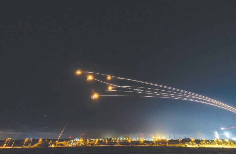  THE IRON Dome air defense system intercepts rockets fired from the Gaza Strip, as seen from Sderot, on Saturday. Over a thousand rockets were fired from the Gaza Strip, but the US wants Israel to stop.  (photo credit: YONATAN SINDEL/FLASH90)