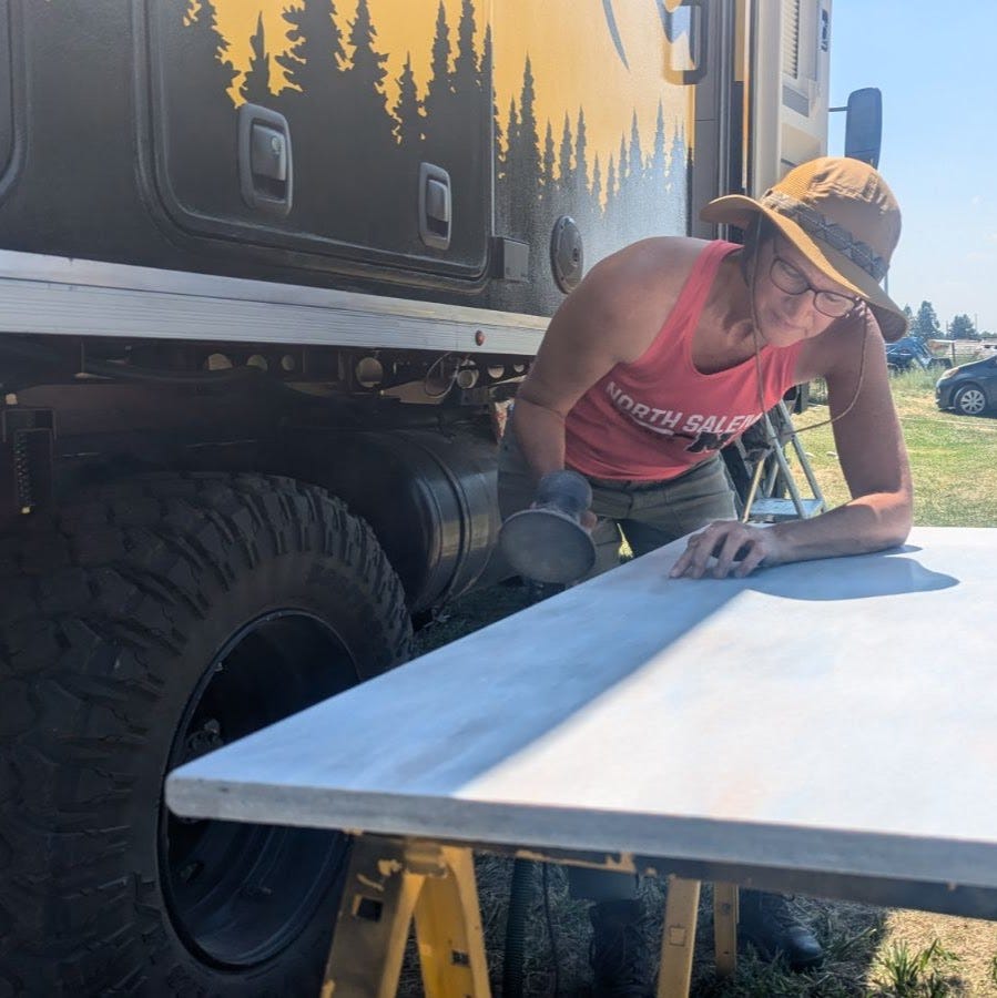 Sherry stopping to touch a spot on the countertop material