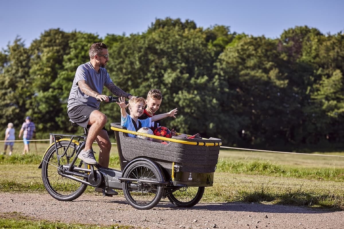 The Raleigh Stride 3 cargo e-trike features a front cargo box that's big enough for up to four young children