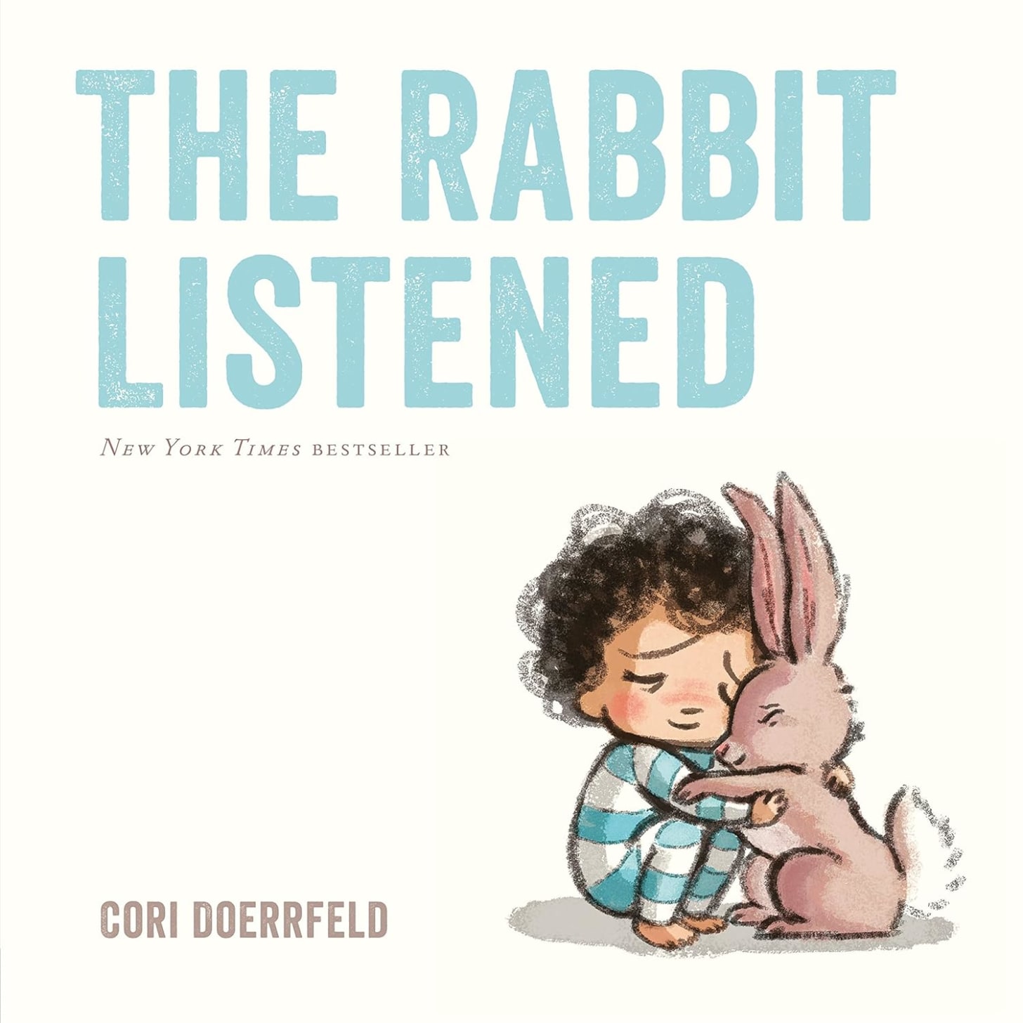 The cover image of the picture book The Rabbit Listened, showing a young child in an embrace with a rabbit against a white background.
