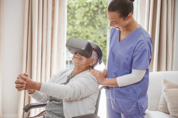 Sometimes all you can say is, WOW! Old woman enjoying virtual reality simulator with her elder care nurse Virtual Reality in Post-Stroke Rehabilitation stock pictures, royalty-free photos & images