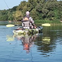 May be an image of 2 people, people fishing, kayak and text