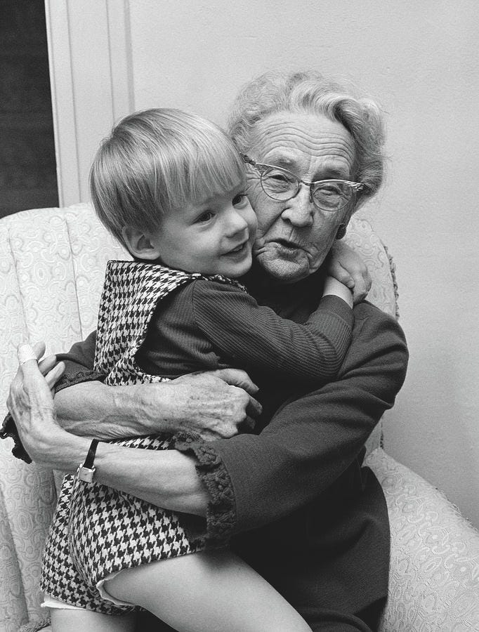 1960s Grandmother In Chair Hugging by Vintage Images