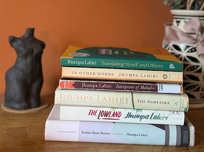 A stack of six books written by Jhumpa Lahiri