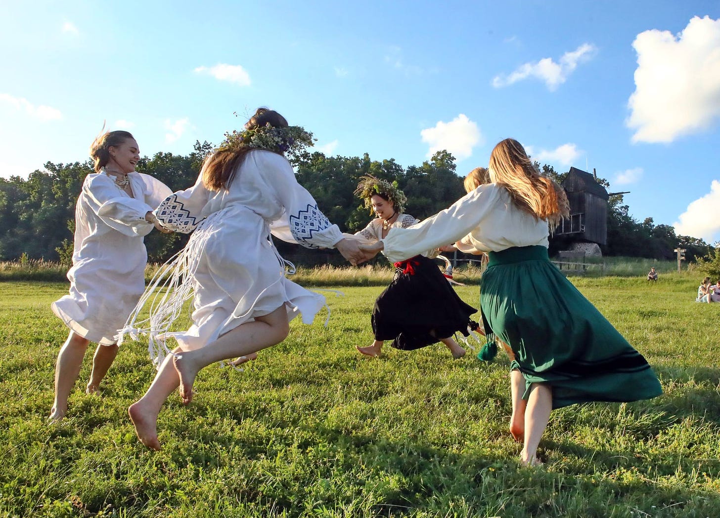 May be an image of 4 people, people dancing and dirndl