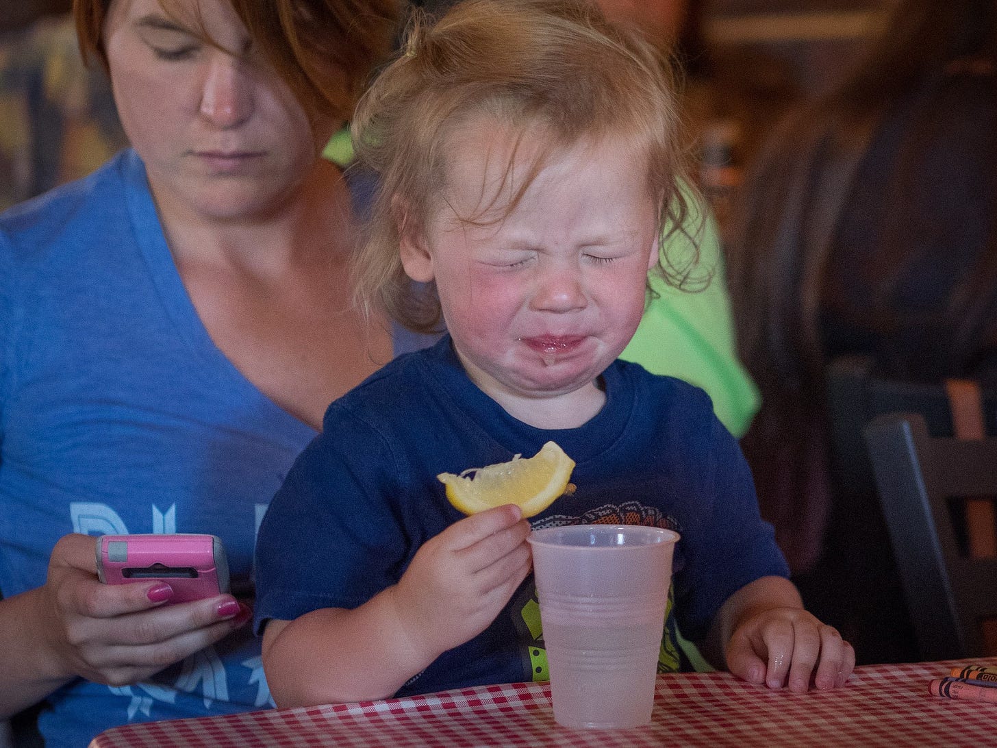 Alex reacts to a taste of a lemon