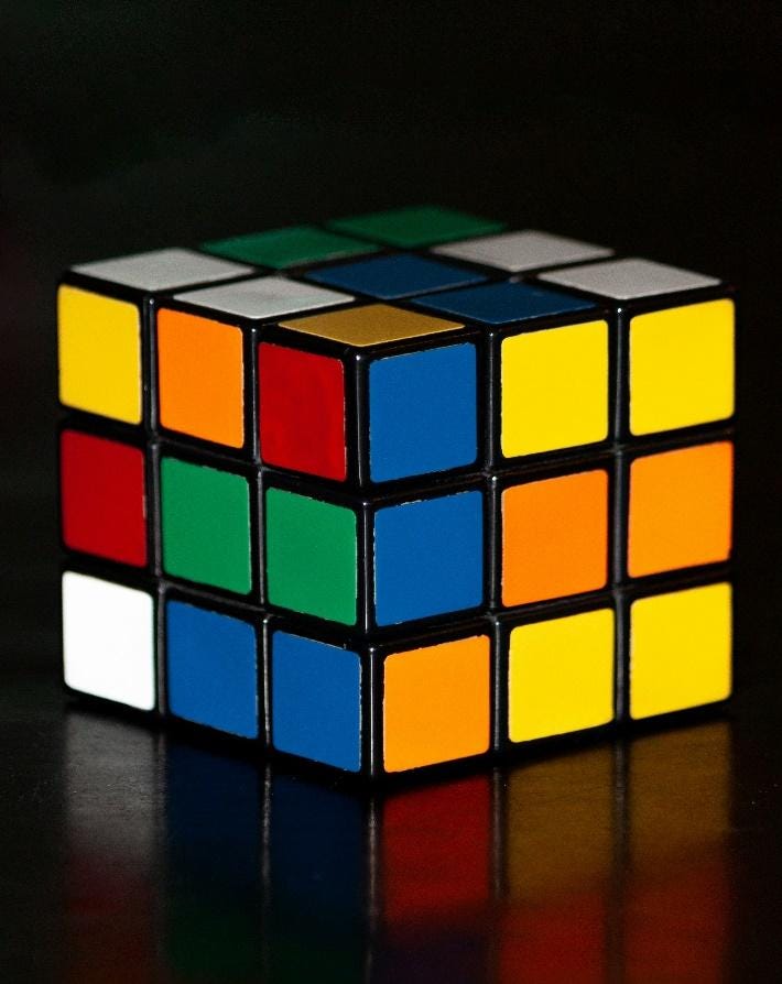 A multicolored cube with many squares

Description automatically generated