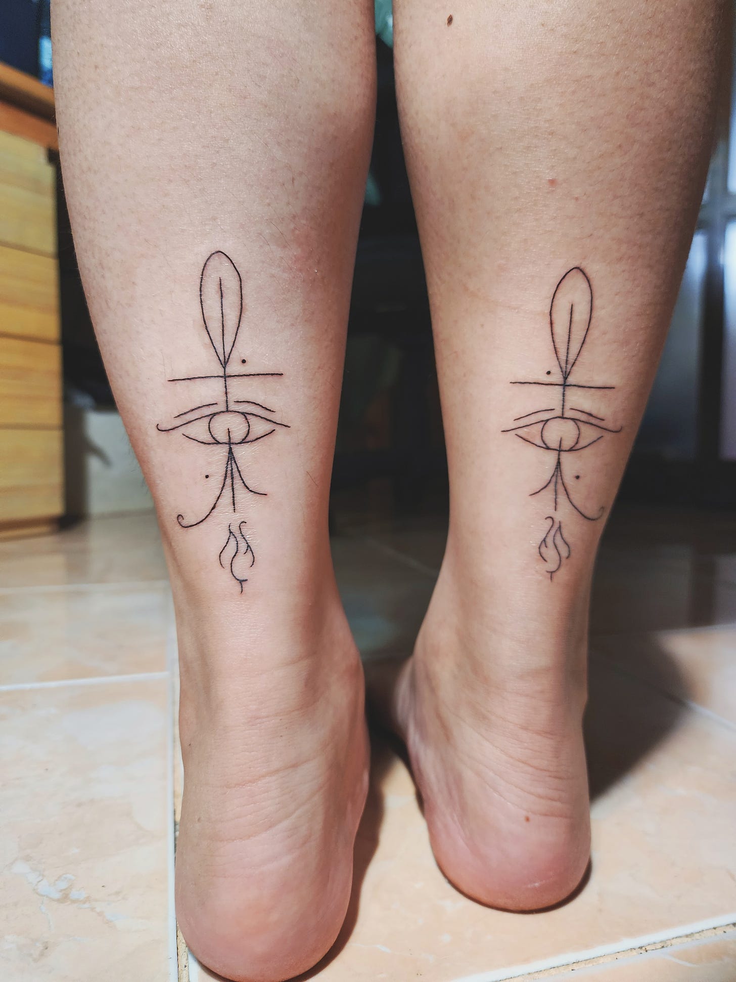 Tattoos on ankles: The Eye of Ra, and The Eye of Horus