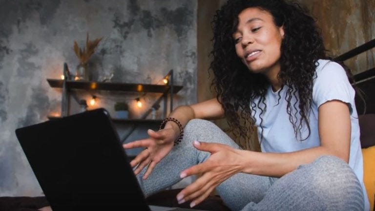 woman interacting with laptop