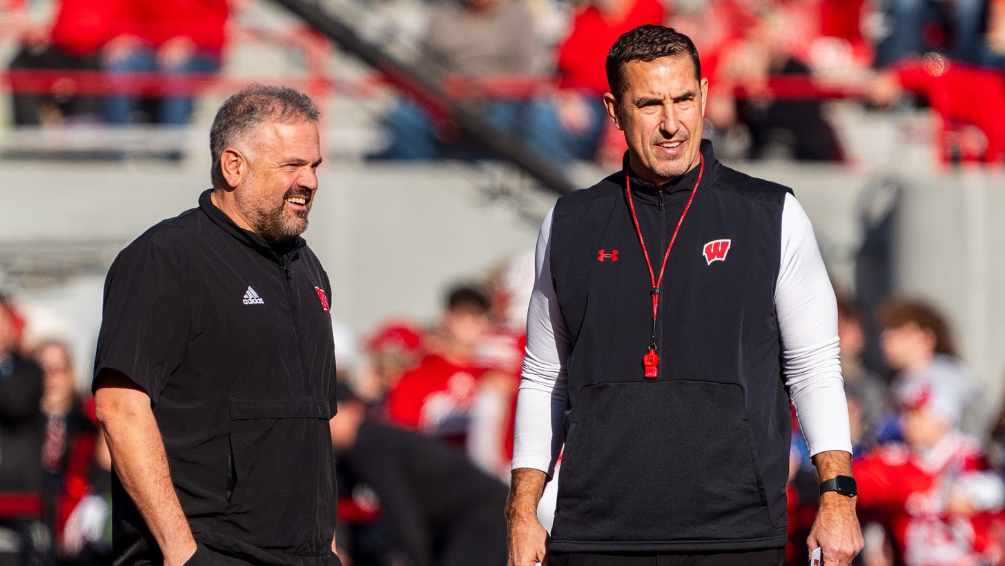 Nebraska Cornhuskers head coach Matt Rhule and Wisconsin Badgers head coach Luke Fickell talk before a game at Memorial Stadium.