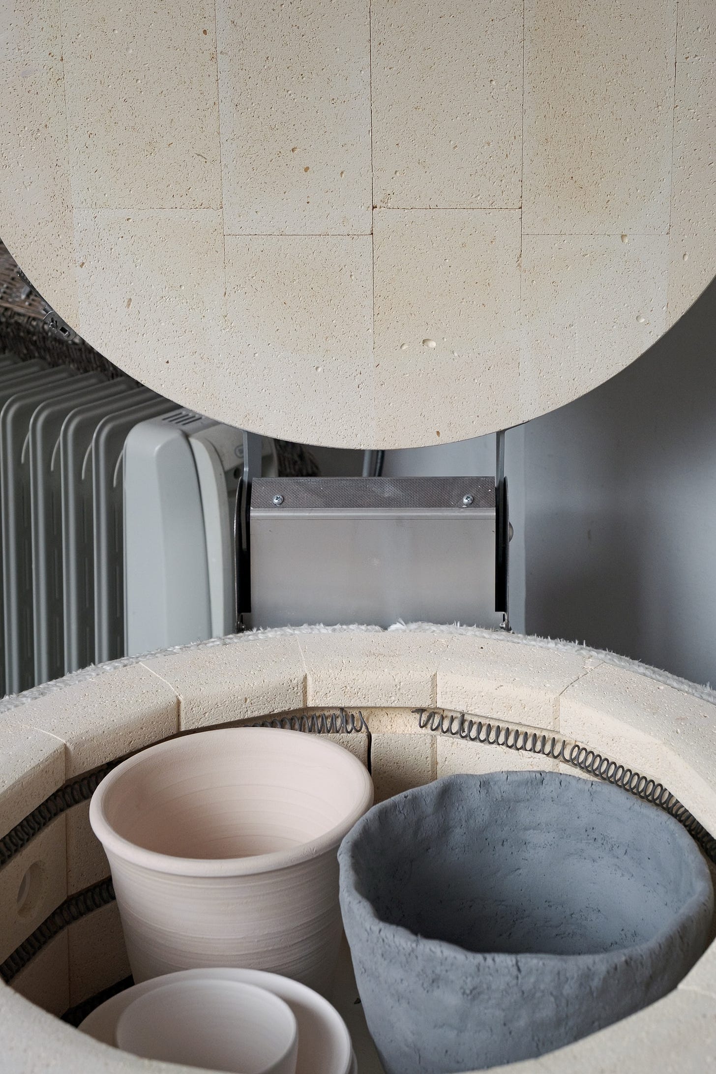 Bisque fired pots in Nabertherm kiln with lid open