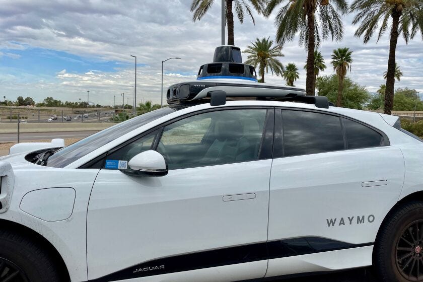 A Waymo driverless taxi on the street in Phoenix, Arizona in August 2023.