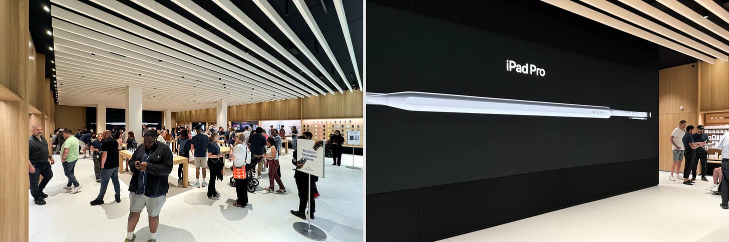 Two interior views of Apple Milton Keynes. The left photo is shot near the front left corner of the store, and the right photo features the backlit Graphic Panel at the back of the store.