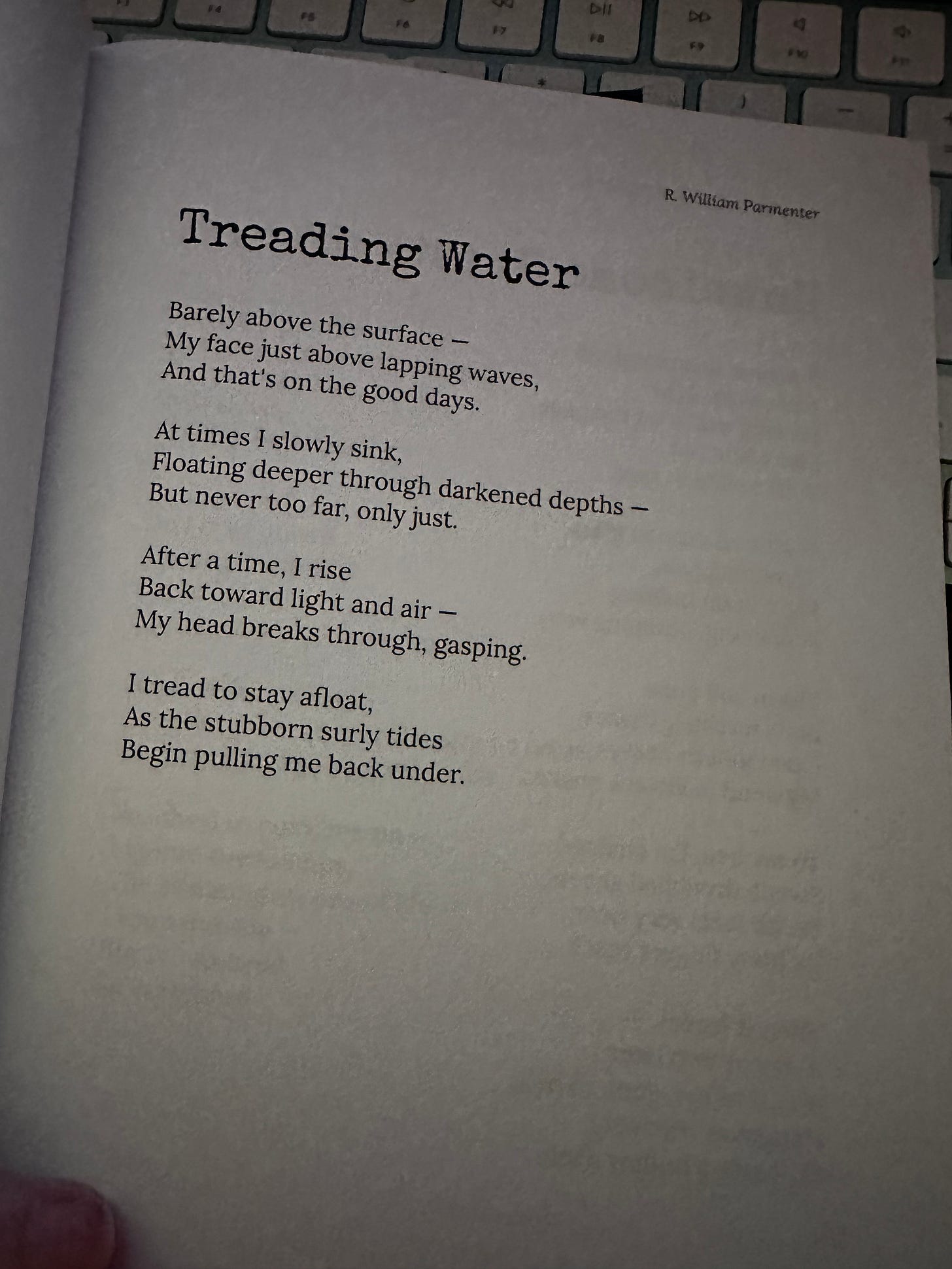 A grainy picture of the poem Treading Water from the poetry collection Between the Dark and the Light by R. William Parmenter. 