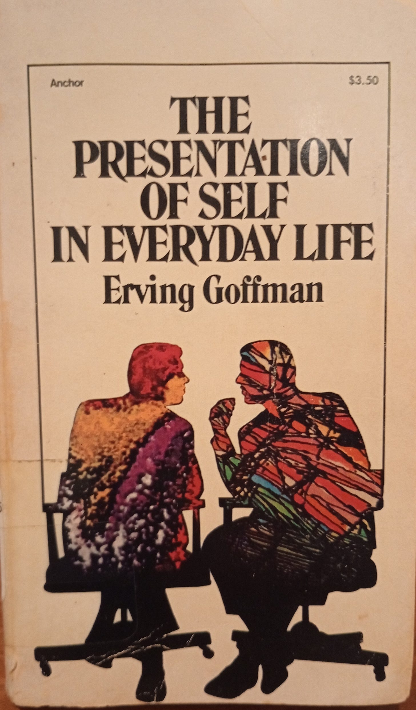 Photo of used book with tan background and two figures on front in red and other colors talking to each other title of book is presentation of self in everyday life