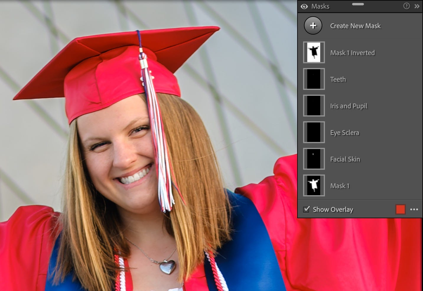 Closeup of woman in cap and gown, with the Masks panel in Lightroom Classic visible to show the masks involved in the edit.