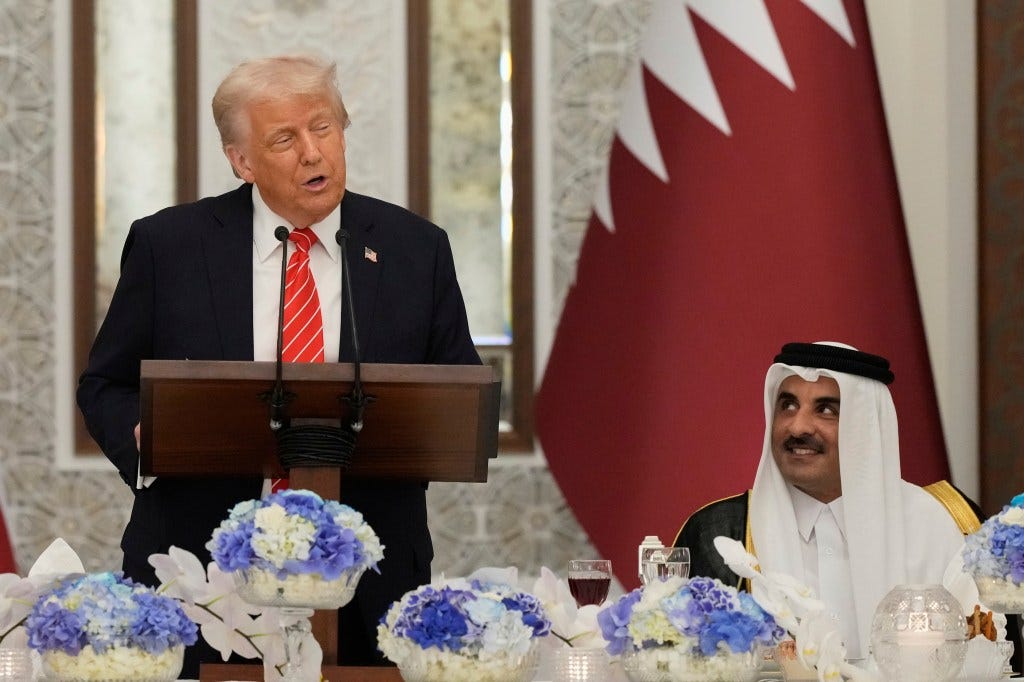 Donald Trump speaks as Qatar's Emir Sheikh Tamim bin Hamad Al Thani looks on during a state dinner at Lusail Palace in Doha, Qatar. (Image: AP Photo)