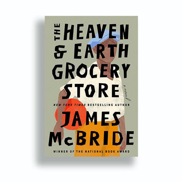 The book cover of “The Heaven & Earth Grocery Store” features a painting of a Black boy wearing a white shirt, blue cap and yellow pants, and holding a red ball.