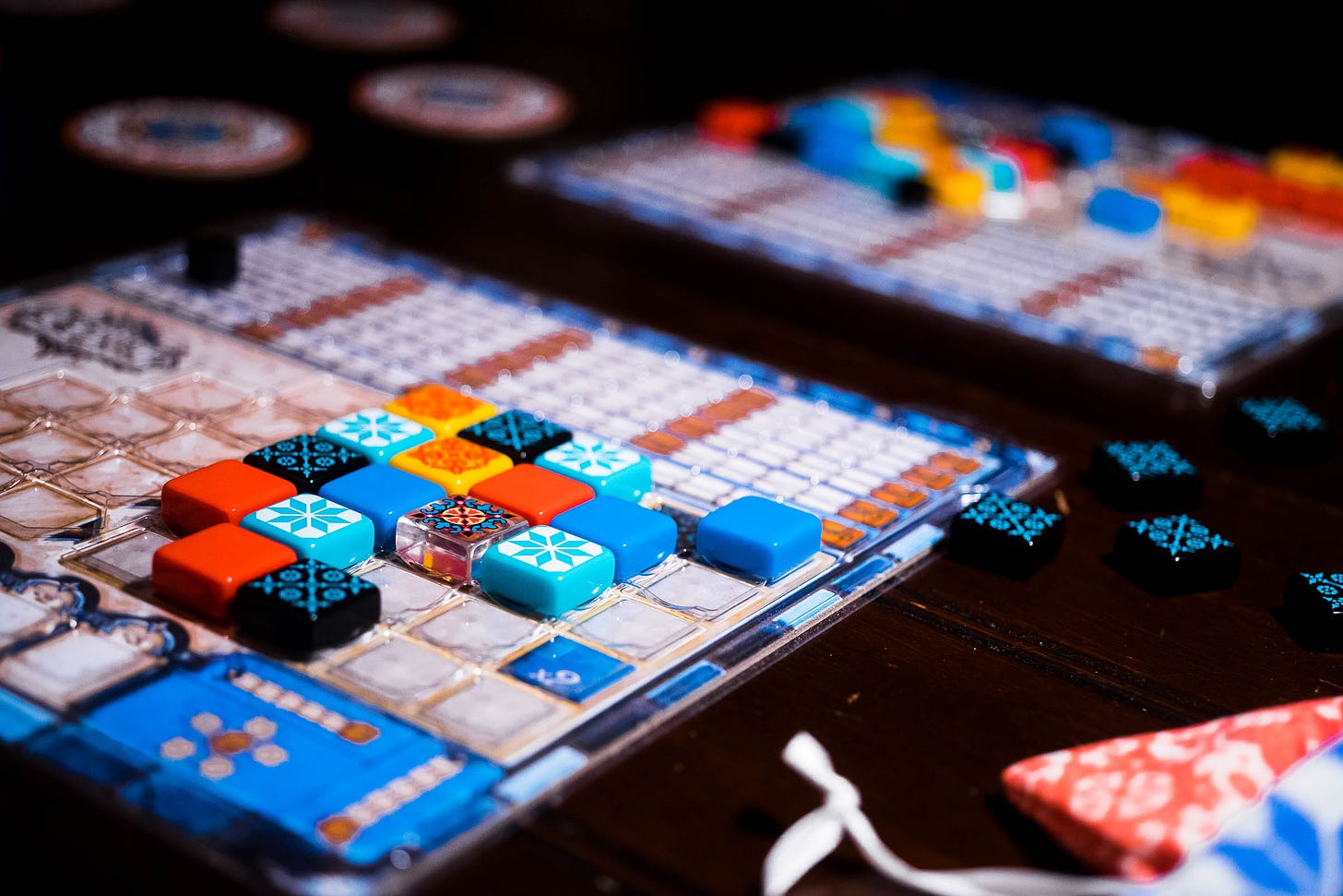 Two player boards opposite each other from the board game Azul 