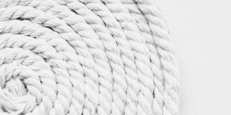 Close up of a white rug on a white background