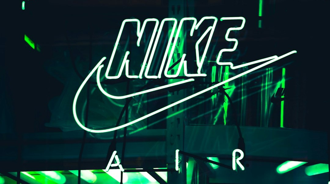 turned-on white Nike neon light signage