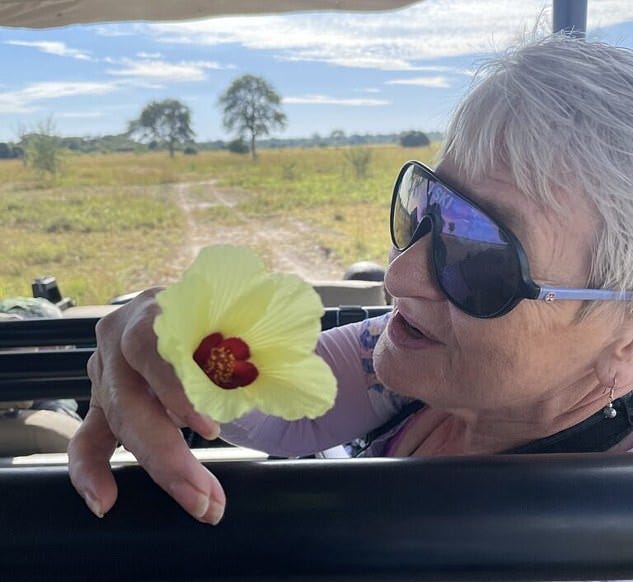 Mattson's family shared heartbreaking pics taken on the day she was killed, which show her holding a flower inside a safari vehicle